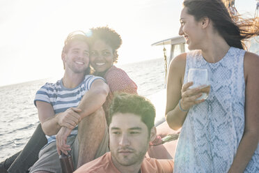 Happy friends on a boat trip having a drink - WESTF22267