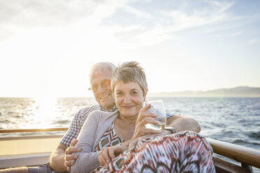 Affectionate couple on a boat trip at sunset - WESTF22292