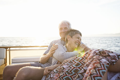 Affectionate couple on a boat trip at sunset - WESTF22294