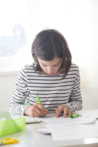 Girl doing homework stock photo