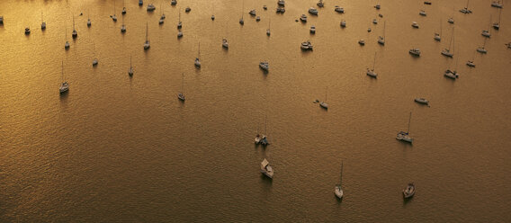 View to moored sailing boats at sunset seen from above - BCDF00245