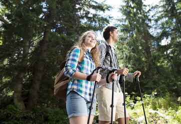 Young couple on a hiking tour in the forest - HAPF01177