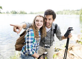 Young couple on a hiking tour at a lake - HAPF01181