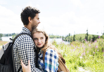 Young couple embracing on a hiking tour - HAPF01190