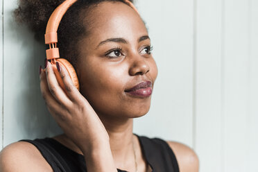 Young woman wearing headphones - UUF09514