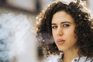 Portrait of smoking young woman - KKAF00169