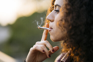 Smoking young woman - KKAF00182