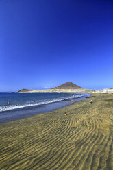 Spain, Tenerife, El Medano beach with Montana Roja in the distance - DSGF01301