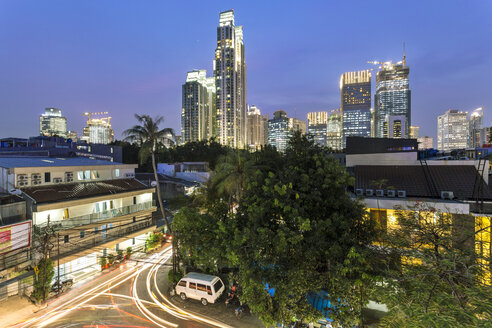 Indonesia, Jakarta, skyline of financial district at night - FPF00115