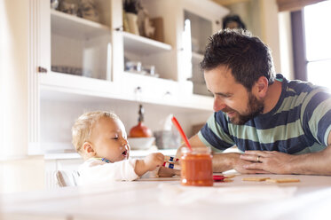 Father and baby at home at dining table - HAPF01209