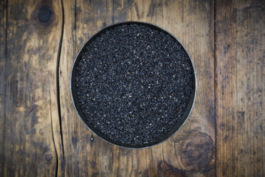 Bowl of organic black sesame on dark wood - LVF05708