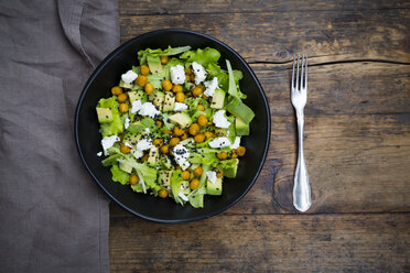 Bowl of leaf salad with roasted chick-peas, avocado, feta and black sesame - LVF05712