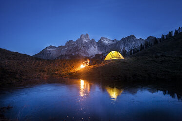 Austria, Salzburg State, Filzmoos, senior man camping in front of Mount Bischofsmutze - HHF05485