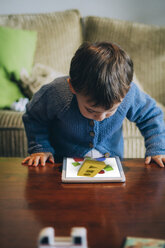 Little boy playing with tablet at home - JPSF00027