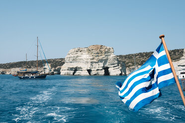 Greece, Milos, Greek boat flag at Kleftiko Beach - GEMF01322