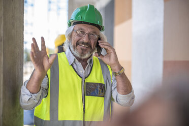 Construction worker on construction site talking on the phone - ZEF11893
