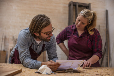 Man and woman working together in woodwork - ZEF11913