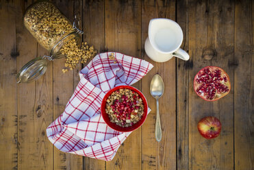 Bowl of overnight oats with blueberries and berry juice on wood - LVF05749