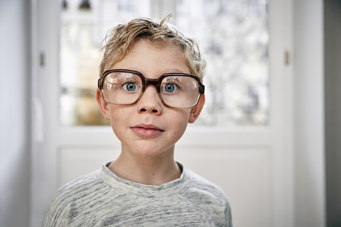 Portrait of boy wearing oversized glasses stock photo