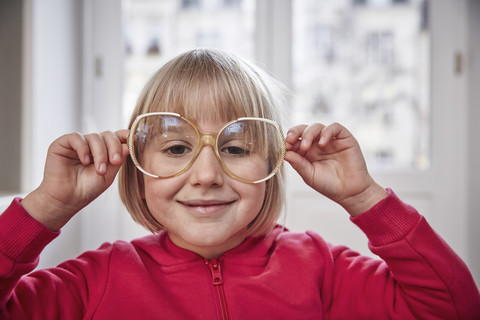 Portrait of girl wearing oversized glasses stock photo