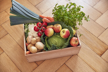 Box with produce on parquet floor - RHF01792