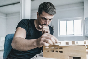 Architect working on architectural model - KNSF00830