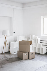 Cardboard boxes in empty loft - KNSF00860