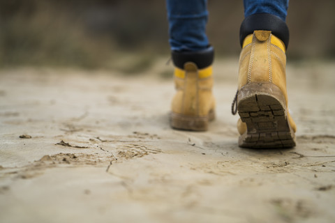 Spain, Navarra, Bardenas Reales, hiking shoes of young woman walking in nature park, close-up stock photo