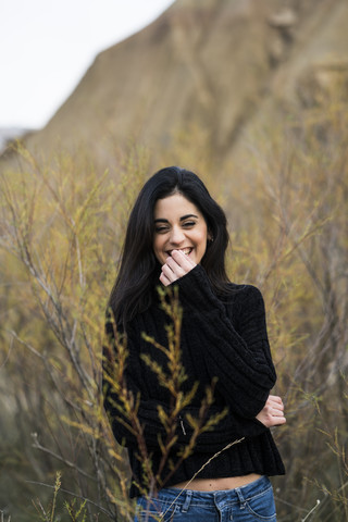 Spain, Navarra, Bardenas Reales, portrait of laughing young woman stock photo