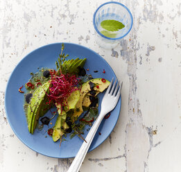 Plate of Iceberg Salad with avocado, thyme, sesame and sprouts - KSWF01772