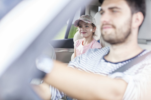 Father and daughter driving in car stock photo