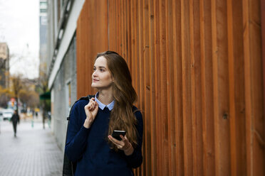 Relaxed young woman with smartphone - VABF01000