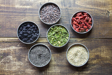 Bowls of chokeberries, chia, cocoa, quinoa, moringa and wolfberries - SARF03104