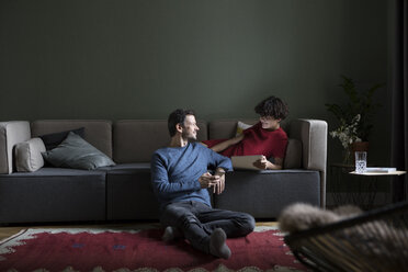 Couple relaxing together in the living room - RBF05461