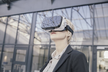 Businesswoman using Virtual Reality Glasses - FMKF03433