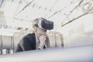 Businesswoman using Virtual Reality Glasses - FMKF03434