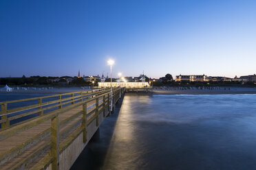 Germany, Usedom, Ahlbeck, view to lighted sea bridge with jetty in the foreground - SIEF07241