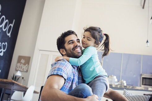 Father and daughter having fun at home - WESTF22422