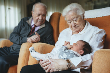 Great grandparents taking care of great granddaughter at home - GEMF01358
