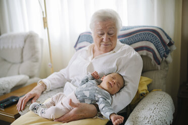 Great grandmother taking care of her great granddaughter at home - GEMF01362