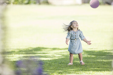 Girl playing with ball in park - ZEF12351