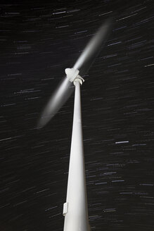 Wind wheel rotating with star trails in the background - DHCF00007