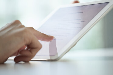 Close-up of woman's hands using digital tablet - RBF05524