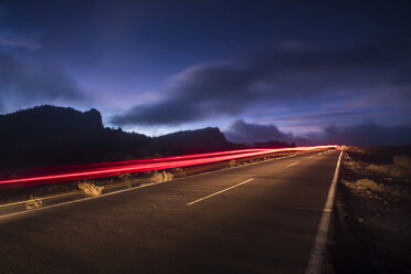 Spain, Tenerife, road with light trails in Teide National Park at night - SIPF01260