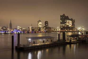 Germany, Hamburg, view to skyline with Hafencity and Elbe Philharmonic Hall at night - WI03385