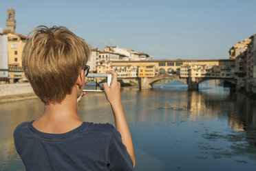 Italy, Tuscany, Florence, Boy taking pictures Ponte Vecchio - PAF01745