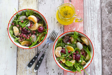 Two bowls with rocket, lychee, tangerine, cream cheese, walnuts, grapes and pomegranate seeds - SARF03114