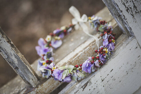 Floral wreath in weathered window frame - ASCF00700