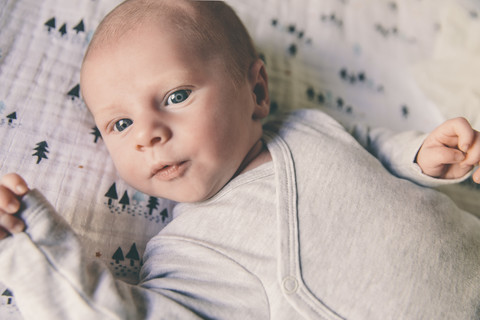 Close-up of newborn baby wearing romper stock photo