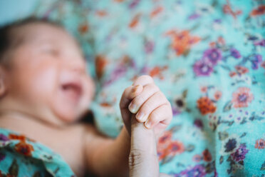Newborn baby girl holding mother's finger - GEMF01387